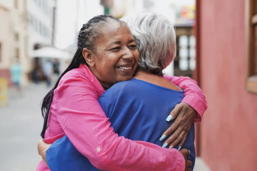 elderly-multiracial-women-hugging-each-other-fri-2023-11-27-05-06-35-utc